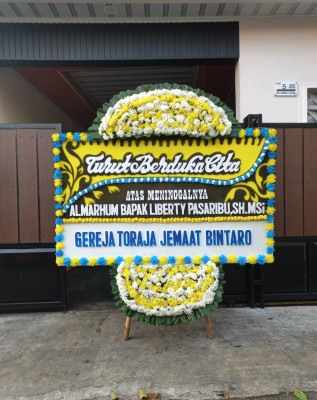 Papan Bunga Duka di Wakuwo
